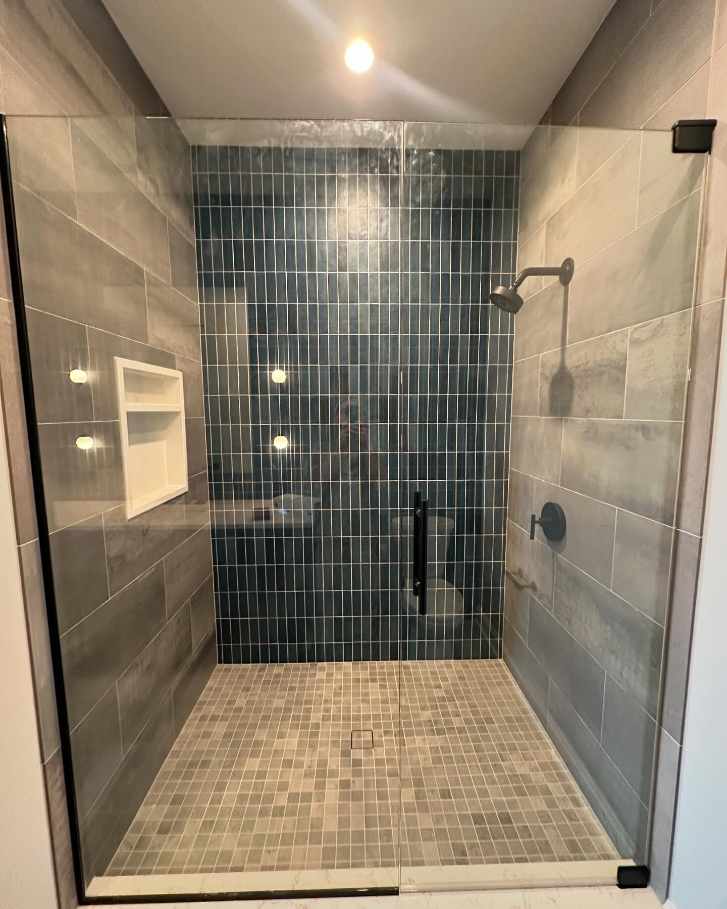 Teal stacked-tile walk-in shower